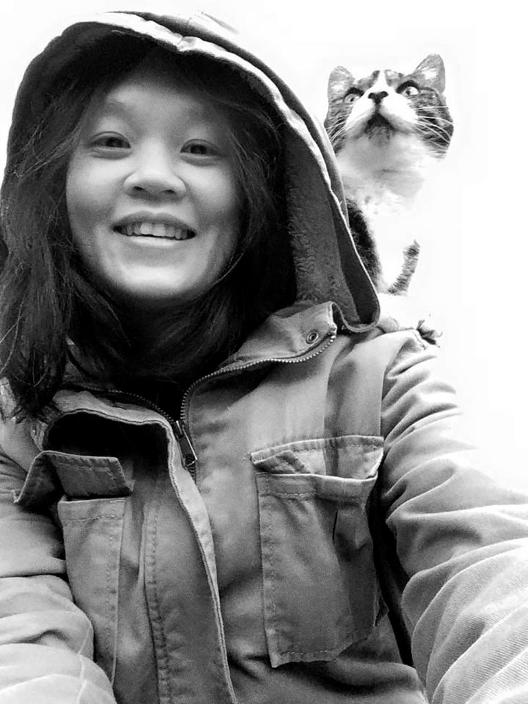 Image of UTN with a cat on her shoulder.
